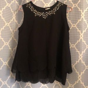 Black Top with sequins and scalloped bottom edge.